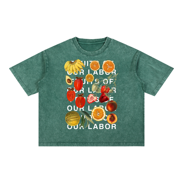 Fruits of Our Labor Tee in blackish green, the campaign name in six lines of off-white type layered over a botanical fruit collage across the chest — On The Job Clothing